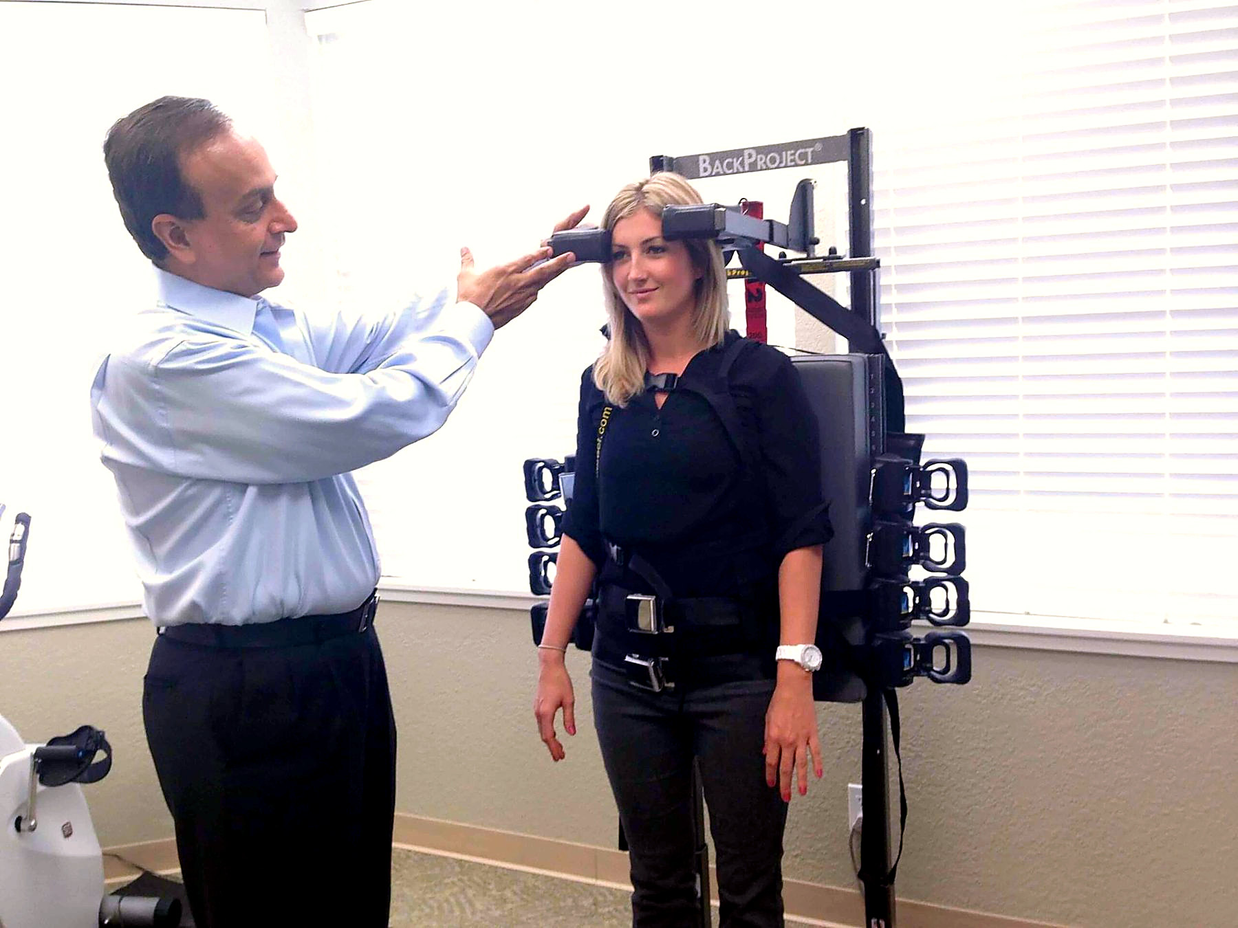 Hiten Davé assessing a patient's posture