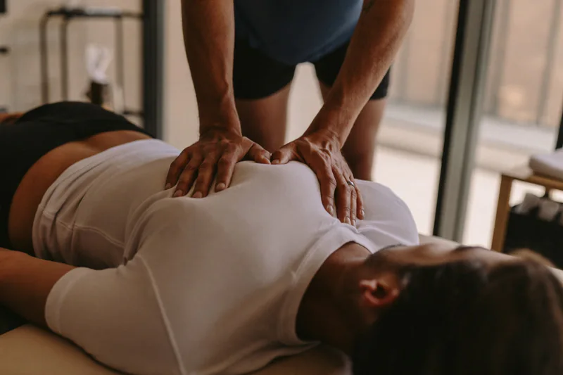 Hands-on treatment of a patient’s back.