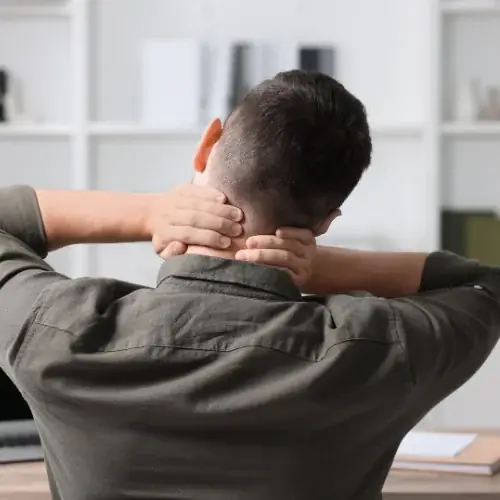 Desk professional easing a stiff neck